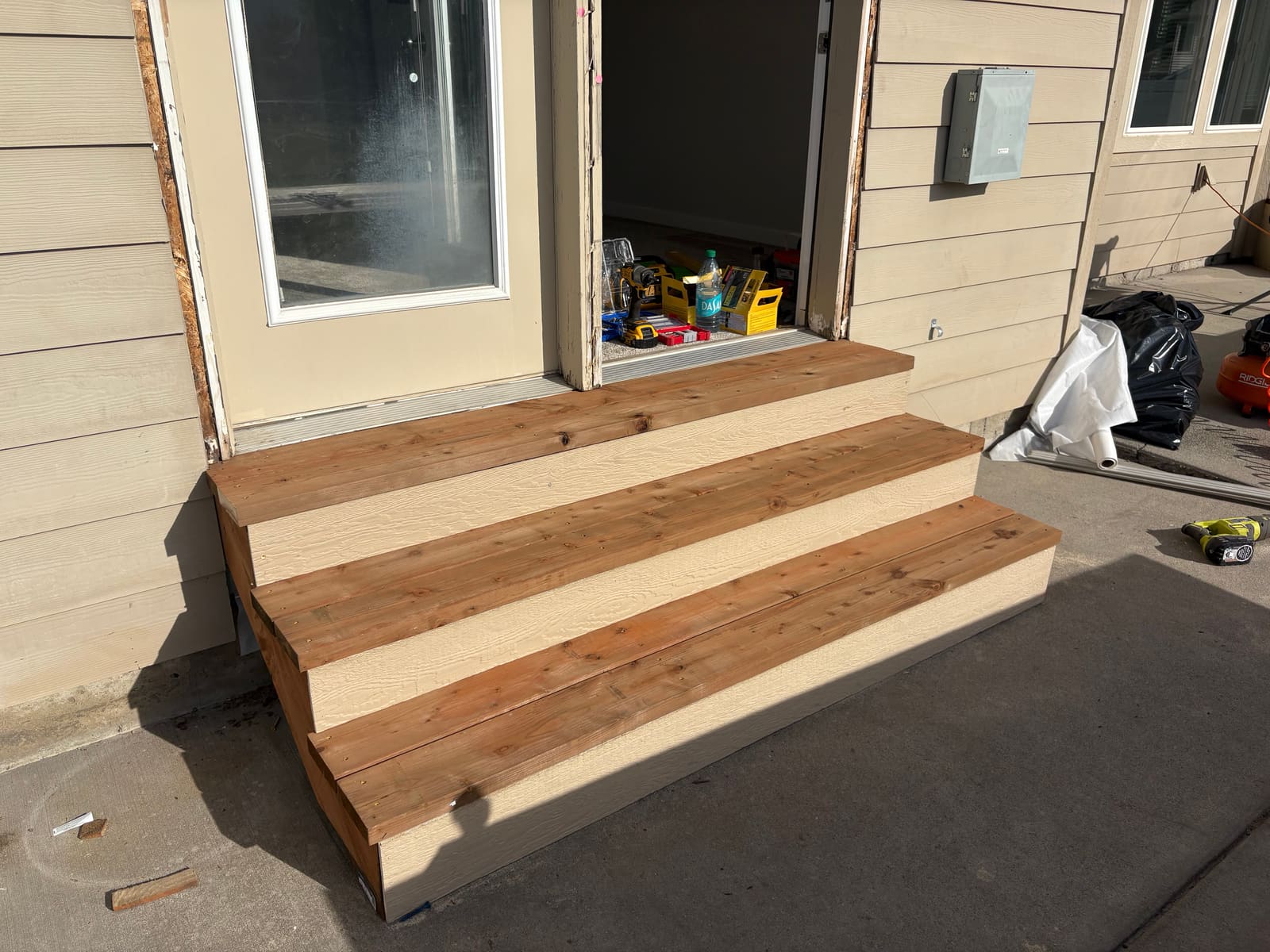 New exterior stairs built at a patio door