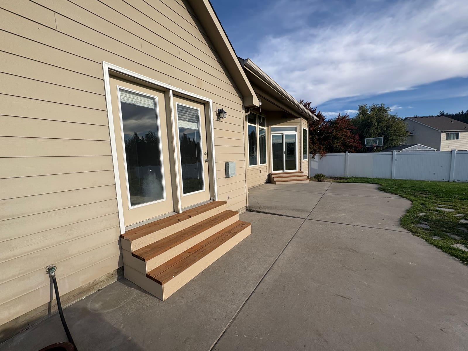 Two sets of finished exterior steps along the back of a home