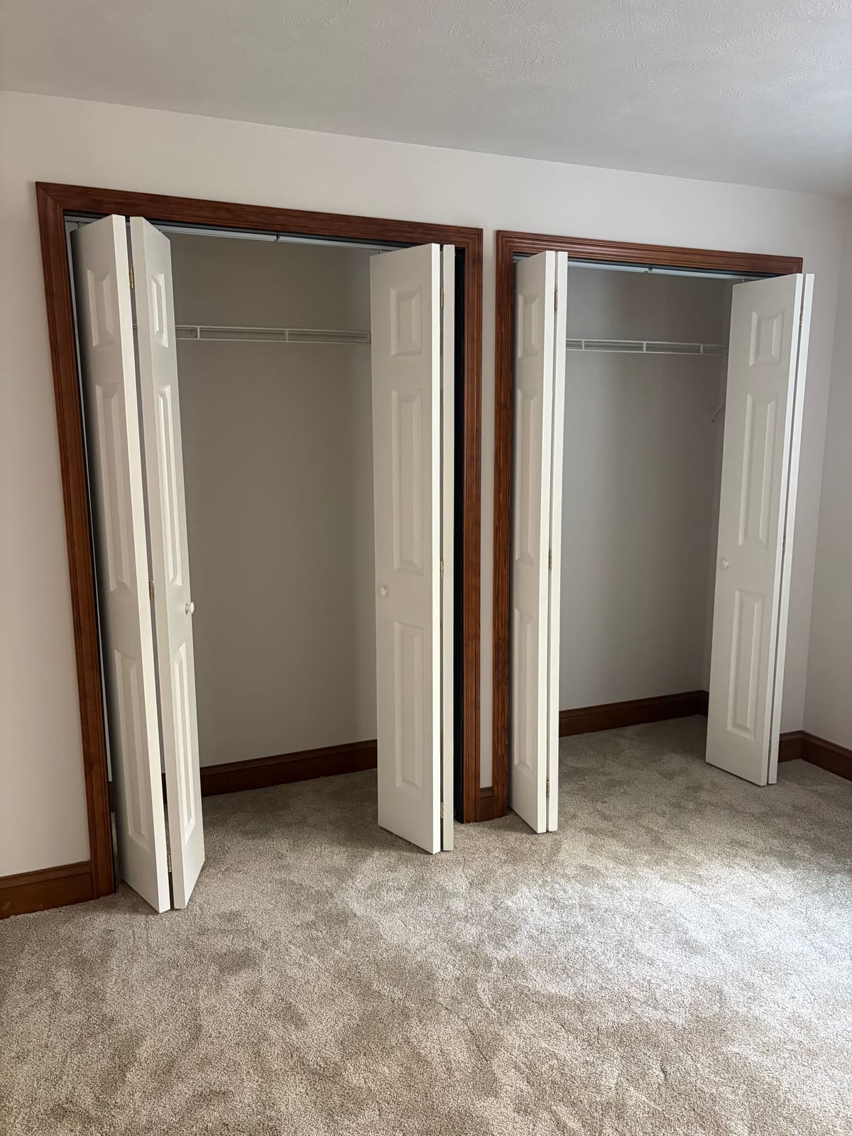 Repaired bifold closet doors in a bedroom